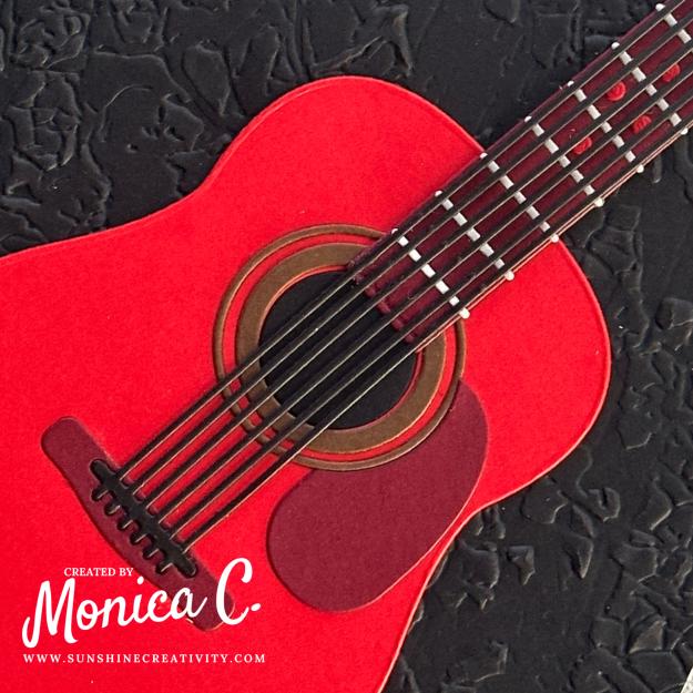 A close up of the Spellbinders Majestic Guitar and its intricate strings